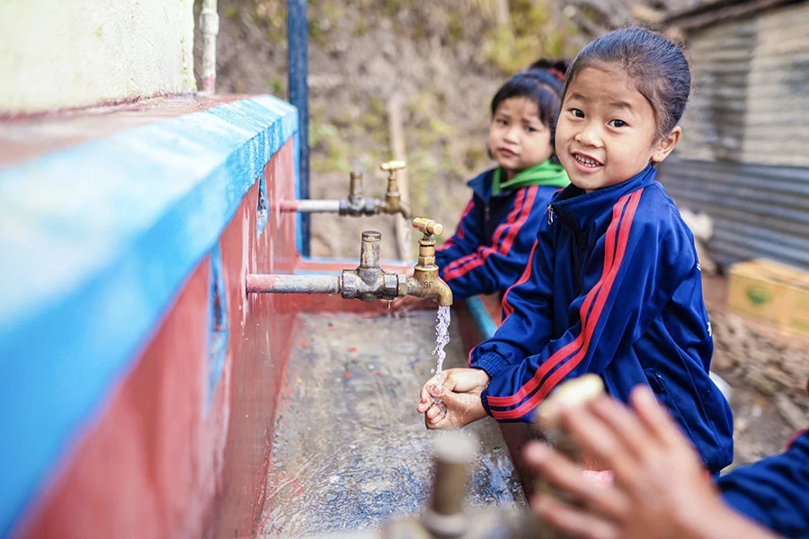 Children washing hand before eating